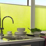 Pleated blinds used in a kitchen setting.